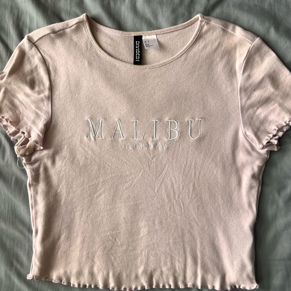 A light purple by the brand divided from H&M in a size small.